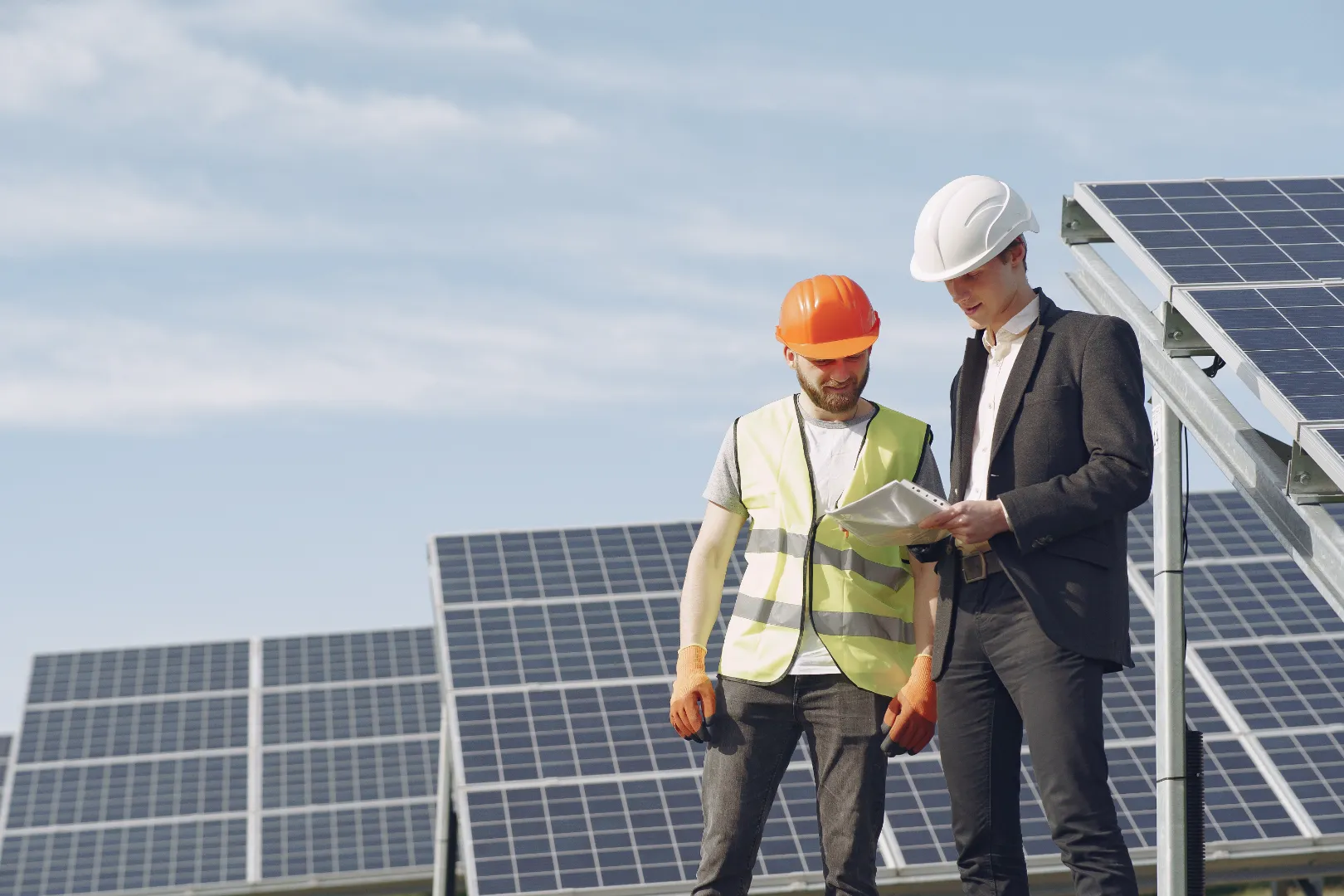 Solar energy station with foreman and businessman